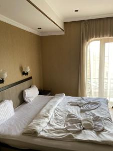 Postel nebo postele na pokoji v ubytování 7 Baits Hotel