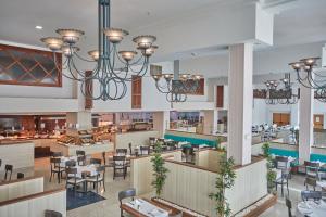 an image of a restaurant with tables and chairs at Sandos Papagayo in Playa Blanca
