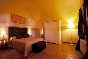 Posteľ alebo postele v izbe v ubytovaní Castello Izzalini Todi Resort