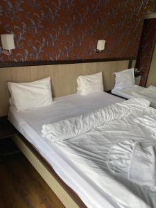 Postel nebo postele na pokoji v ubytování 7 Baits Hotel