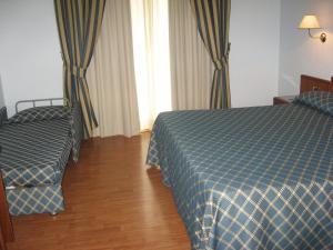 Postelja oz. postelje v sobi nastanitve Hotel Levante