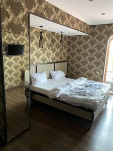 Postel nebo postele na pokoji v ubytování 7 Baits Hotel