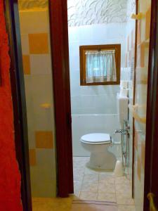 a bathroom with a toilet and a shower at Ianua Coeli 2 in Mosso Santa Maria