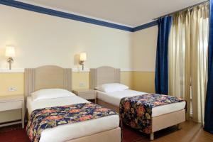 Postel nebo postele na pokoji v ubytování Amadria Park Apartments Šibenik