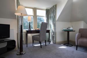a room with a desk and a chair and a window at Nether Abbey Hotel in North Berwick