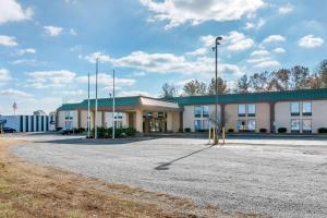 a large building with a parking lot in front of it at Quality Inn in Cape Girardeau