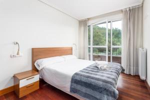 Ένα ή περισσότερα κρεβάτια σε δωμάτιο στο Balea 6 - Local Rentss