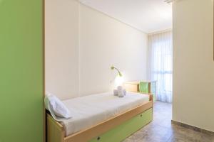 a bedroom with a bed and a mirror at Balea 3 - Local Rentss in Orio