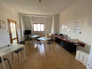 a living room with a table and chairs and a dining room at Campobasso 30E in Campobasso