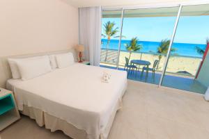 Postel nebo postele na pokoji v ubytování Hotel Praia Dourada + 37 fotografií