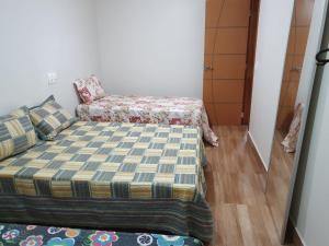 Postel nebo postele na pokoji v ubytování Casa com Piscina e Churrasqueira e excelente Localização em Piuma