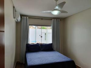 Postel nebo postele na pokoji v ubytování Casa com Piscina e Churrasqueira e excelente Localização em Piuma