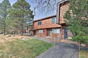 an exterior view of a brick house with a yard at 1 Mi to Shore Quiet South Lake Tahoe Condo in South Lake Tahoe