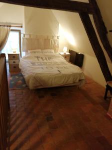 Ένα ή περισσότερα κρεβάτια σε δωμάτιο στο La maison de Xenos