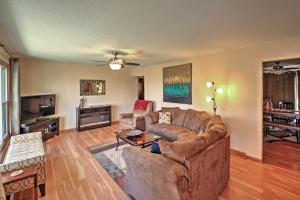 a living room with a couch and a table at Quaint Duluth Hideaway with Private Fenced-In Yard! in Duluth