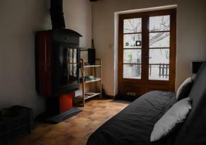 Postel nebo postele na pokoji v ubytování Gîte du tilleul - 2 étoiles - domaine de l'olivier + 28 fotografií