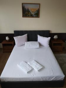 Postel nebo postele na pokoji v ubytování Hotel Duka