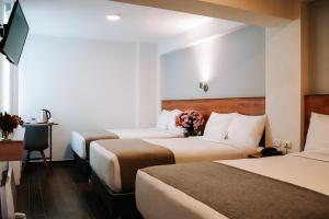 Katil atau katil-katil dalam bilik di Muru Homely Hotel Cusco
