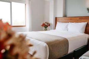 Katil atau katil-katil dalam bilik di Muru Homely Hotel Cusco