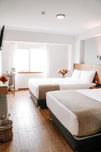 Katil atau katil-katil dalam bilik di Muru Homely Hotel Cusco