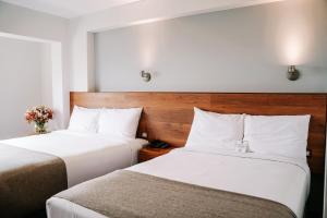 Katil atau katil-katil dalam bilik di Muru Homely Hotel Cusco