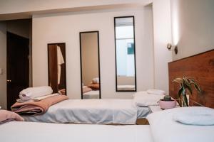 Katil atau katil-katil dalam bilik di Muru Homely Hotel Cusco