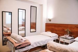 Katil atau katil-katil dalam bilik di Muru Homely Hotel Cusco
