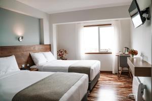 Katil atau katil-katil dalam bilik di Muru Homely Hotel Cusco