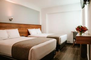Katil atau katil-katil dalam bilik di Muru Homely Hotel Cusco