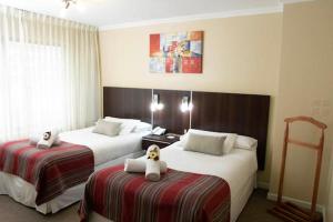 Rúm í herbergi á Hotel Don Eduardo