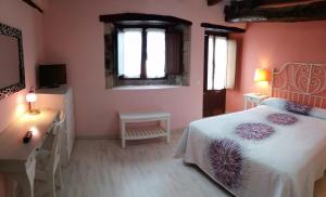 A bed or beds in a room at Apartamentos El Majuelo