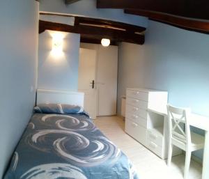 A bed or beds in a room at Apartamentos El Majuelo