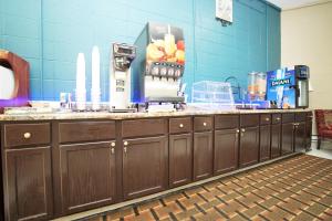 a kitchen with a counter with a coffee maker on it at Faribault Hometown Inn & Suites in Faribault