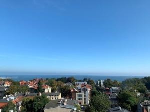 a city skyline with the ocean in the background at Apartment Sopot in Sopot