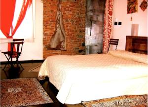 A bed or beds in a room at Torre Ducale Dimora Storica