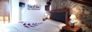 A bed or beds in a room at Apartamentos El Majuelo