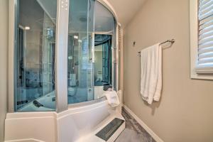 a bathroom with a shower and a bath tub at Calvert City Home, 8 Miles to Kentucky Lake! in Calvert City +24 photos