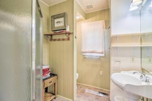 a bathroom with a sink and a toilet at Lake Martin Cabin with Luxury Dock and Kayaks! in Eclectic +26 photos