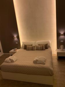 Postel nebo postele na pokoji v ubytování La Banchina Holiday Rooms