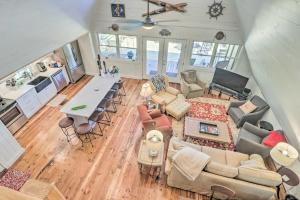 an overhead view of a living room with a couch and chairs at Lake Martin Cabin with Luxury Dock and Kayaks! in Eclectic