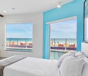 a hotel room with a view of the ocean at Ocean Treasure Beachside Suites in Fort Lauderdale