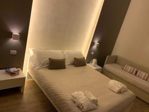 Postel nebo postele na pokoji v ubytování La Banchina Holiday Rooms