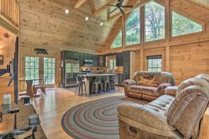 a living room with two couches and a kitchen at Palmerton Cabin with Game Room about 5 Mi to Blue Mtn in Palmerton