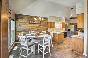 a kitchen and dining room with a table and chairs at Family-Friendly Home with Hot Tub, Fire Pit and Deck! in San Antonio