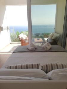 A bed or beds in a room at Lakones Deluxe Suites A