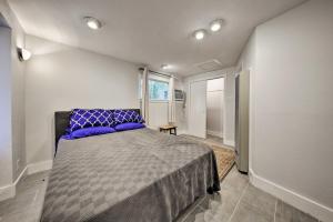 a bedroom with a large bed with purple pillows at Downtown Austin Apt with Patio, Perfect for Two! in Austin