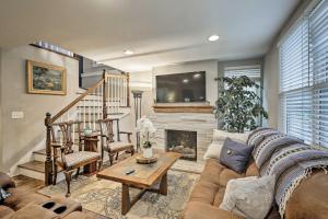 a living room with a couch and a fireplace at Nashville Home with Fire Pit and Yard, 3 Mi to Dwtn in Nashville