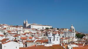 a view of a city with red roofs at Memmo Alfama - Design Hotels in Lisbon