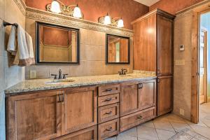 a bathroom with two sinks and a mirror at North Shore Luxury Cabin By Gooseberry Falls! in Castle Danger
