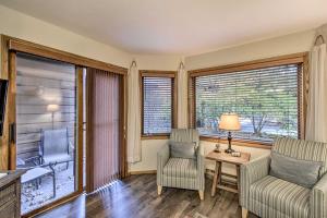 
a living room filled with furniture and a window at Condo with Resort Amenities - 1 Mile to Beach and Golf in Egg Harbor
